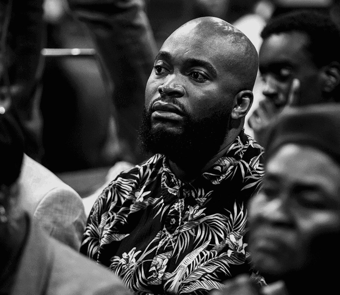 A young minister in the audience, deeply engaged in the teaching